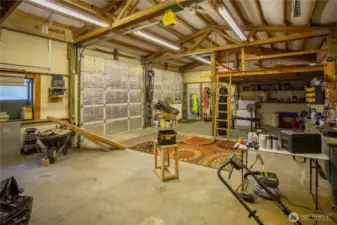 Big double doors, cement floor, storage lofts