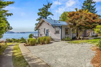 Entering through the east gate, you'll find ample parking near the home—perfect for guests, gatherings, or accommodating recreational vehicles—all just steps from the front door.