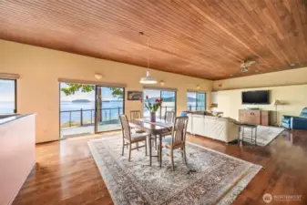 The spacious dining area offers plenty of room for entertaining guests, hosting holiday dinners, or enjoying everyday meals—all with a view and a warm, welcoming atmosphere.