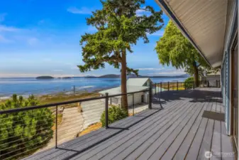 This photo was taken facing southwest toward Guemes Island, capturing the stunning water views from the deck. The deck features a new handrail and was designed to offer unobstructed views and peaceful outdoor living.