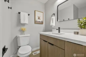 Updated primary bathroom featuring sleek, modern finishes