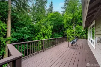 A large back deck for outdoor enjoyment with stairs leading to the fully fenced back yard. The covered patio is great for year round enjoyment.