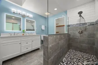 Heated floors, double vanity, plus a large walk-in closet off the bathroom - as well as a linen closet and a traditional closet.