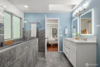Your going to love this shower! Recently updated primary bathroom with LED back lit mirrors a resting bench and plenty of room.