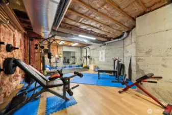 The unfinished 575 sq ft room is being used as a home gym.