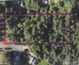 Two 1+ acre lots on a paved street with power and water in the street.