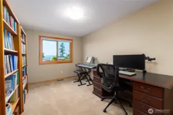 4th bedroom on the main floor which is currently being utilized as an office. It offers views of the water and islands!