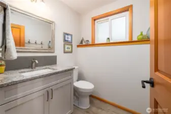 Downstairs powder room has been nicely updated.