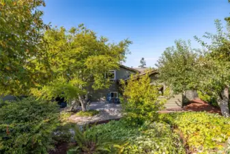 Lush landscaping, flagstone path and wonderful vignettes to enjoy.