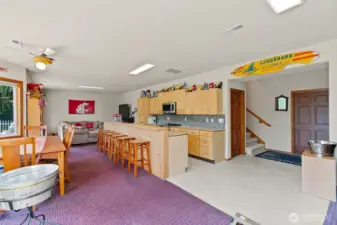 Basement with kitchen, dining, bedroom, and full bath.