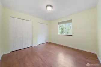 Comfortable secondary bedroom with peaceful views.