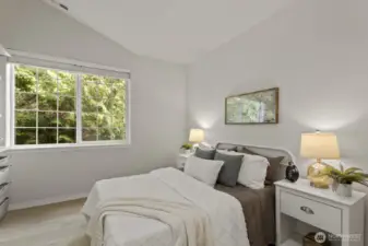 The second bedroom is nice and spacious as well, with a serene treed view right outside.