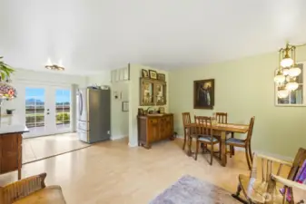 French doors allow natural light to fill the room & invite you to explore outside on the massive deck.