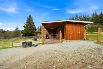 Great overhang on west side with cross ties & rubber mats is a beautiful thing on a wet day and you still want to hang out with the horses.