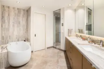 Lavish Master Bathroom is blissful! Let's start with steam shower, relaxing soaking tub and continue with double sinks, Toto Bidet, heated Floors, and to top it off - a built-in television in the mirror.