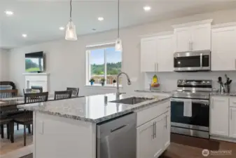 Kitchen with granite and upgraded appliances