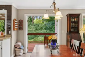 French doors open to balcony off dining area