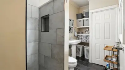 Full walk-in tiled shower - much larger than the photo shows.