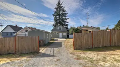The property extends at least 8 feet beyond the fence.