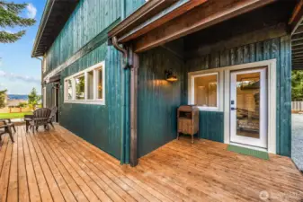 Covered back entry and side deck on South & East side of home.