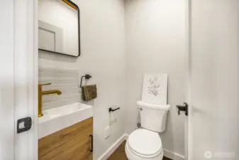 1/2 bath for guests across the from the coat and laundry closets.
