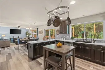 Kitchen island can be removed if you'd like. It currently adds additional counter space and seating.