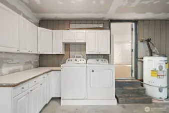The laundry area is in the garage. TONS of storage here too.