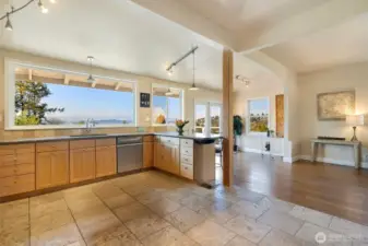 This picture shows the kitchen with the portable island moved out. Your choice in this beautiful space.