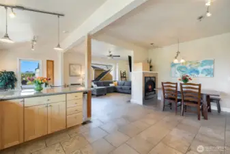 Looking from the kitchen, at the dining room space. An entertainers dream with a double-sided fireplace and wide open space.