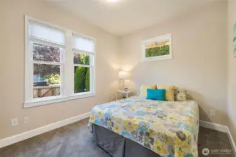 Main floor bedroom is spacious and bright