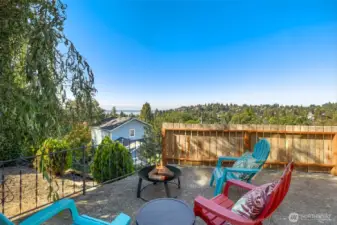 Another space to get away… The lower patio has a view and offers multiple levels of entertaining. Enjoy yourself around the fire pit while watching the ferries roll by.