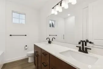 Two of the secondary bedrooms joined by Jack and Jill Bathroom. Each with own separate vanity.
