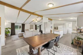 Another view of the great room; vaulted ceilings, ample dining room space looking towards living room seating area.  New kitchen cabinets, countertops, most applicances newer,