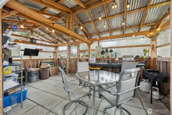 Well isn't this fun!  RV living area, interior photo, of covered and mostly enclosed entertainment and storage space.  Very Pacific Northwest!