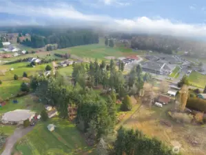 Aerial view of this great 3.86 acre property and East Olympia Elementary in the background.
