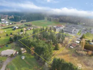 Aerial with estimated property lines depicted for informational purposes only.  East Olympia Elementary in the background.