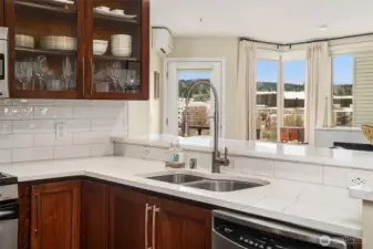 Newer hardwood cabinets with quartz countertops