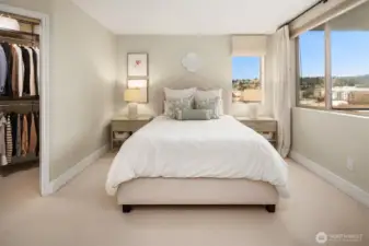 Your Primary Bedroom is filled with natural light, custom shades are black out.