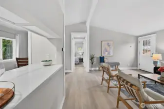 From the living room, head west to discover two additional bedrooms and a full bath—comfortably tucked away for privacy.