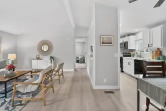 From the west wing bedrooms, the home opens back toward the living area and primary suite.