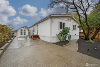 Pull up, park, and feel right at home—this charming property offers the ease of single-level living with the rare benefit of land you own.