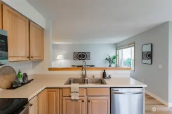 Kitchen looks out into the living room.  Convert upper counter to an eating bar!