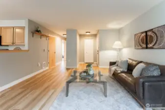 From the living room, kitchen to the left, full bath at the hallway down to the bedrooms, entry is straight ahead.