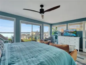 Primary bedroom with exterior deck with sound view.