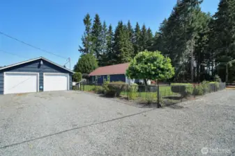 Extra large two car garage with storage and workshop, plenty of parking, grass has been retouched