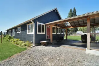 Rear entrance of home, dog door access, entrance to patio area, grass has been retouched