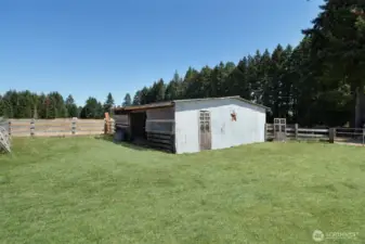 Pole barn with power, tack room, poultry shed, hay and feed room, grass has been retouched