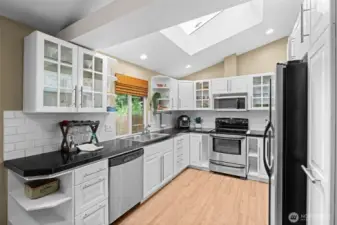 White cabinetry with display shelving and upper glass panel doors for your treasures.