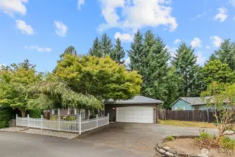 Front elevation and circular driveway.