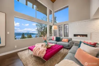 Soak in breathtaking views of the lake and Seattle skyline through expansive living room windows facing west and north. The stunning stained glass windows bring timeless charm to the space.
